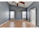 Bedroom featuring vaulted ceilings, a ceiling fan, and two windows with valences at 755 James Ridge Dr, Lawrenceville, GA 30045