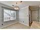 Cozy breakfast nook with large window and decorative lighting fixture at 755 James Ridge Dr, Lawrenceville, GA 30045