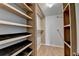 Closet with custom shelving and laminate floors at 755 James Ridge Dr, Lawrenceville, GA 30045