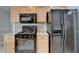 A kitchen showcasing stainless steel appliances and sleek granite countertops at 755 James Ridge Dr, Lawrenceville, GA 30045