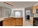 Kitchen with granite countertops, stainless appliances, and a connecting laundry room at 755 James Ridge Dr, Lawrenceville, GA 30045