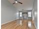 Spacious living room with hardwood floors, neutral paint, a ceiling fan, and a decorative fireplace at 755 James Ridge Dr, Lawrenceville, GA 30045