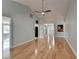 Large living room featuring hardwood floors, vaulted ceiling, neutral paint, ceiling fan, and natural light at 755 James Ridge Dr, Lawrenceville, GA 30045