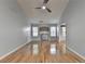 Spacious living room with hardwood floors, neutral paint, a ceiling fan, and a decorative fireplace at 755 James Ridge Dr, Lawrenceville, GA 30045