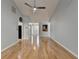 Large living room featuring hardwood floors, vaulted ceiling, neutral paint, ceiling fan, and natural light at 755 James Ridge Dr, Lawrenceville, GA 30045
