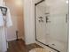 Bathroom featuring glass shower enclosure with a walk-in shower and neutral color scheme at 109 Auburn Crossing Dr, Auburn, GA 30011