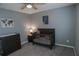 Neutral Bedroom featuring a dark wood crib, dresser, and stylish decorations at 109 Auburn Crossing Dr, Auburn, GA 30011