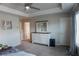 Comfortable bedroom with a ceiling fan, tray ceiling, dresser with mirror and ample natural light from the large window at 109 Auburn Crossing Dr, Auburn, GA 30011