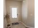 Entryway featuring neutral colored walls, white trim, and a decorative potted plant at 109 Auburn Crossing Dr, Auburn, GA 30011