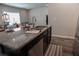 Kitchen island with stainless steel appliances and views into the living room at 109 Auburn Crossing Dr, Auburn, GA 30011