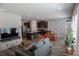 Open-concept living area with kitchen, dining, and seating, filled with natural light at 109 Auburn Crossing Dr, Auburn, GA 30011