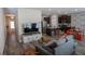 Spacious living room seamlessly connected to the kitchen, featuring hardwood floors at 109 Auburn Crossing Dr, Auburn, GA 30011