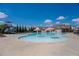 Community swimming pool with mushroom water feature, slide, and surrounding lounge area at 109 Auburn Crossing Dr, Auburn, GA 30011