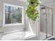 Relaxing bathroom featuring a soaking tub and a separate shower at 2099 Easterwood Ter, Decatur, GA 30032