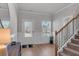 Foyer with hardwood floors, staircase and natural light from large windows at 2099 Easterwood Ter, Decatur, GA 30032