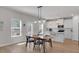 Open-concept kitchen and dining area with stainless appliances, quartz countertops and pendant lighting at 2099 Easterwood Ter, Decatur, GA 30032