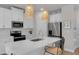 Bright kitchen featuring stainless appliances, quartz countertops and pendant lighting at 2099 Easterwood Ter, Decatur, GA 30032