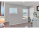 Bright home office space with two large windows, modern furnishings and carpeted floor at 2099 Easterwood Ter, Decatur, GA 30032
