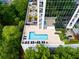 Aerial view of the rooftop pool deck with lounge chairs and city views at 2828 Peachtree Nw Rd # 1501, Atlanta, GA 30305