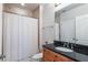 Cozy bathroom featuring a shower-tub combo, granite countertops, and a neutral color palette at 2828 Peachtree Nw Rd # 1501, Atlanta, GA 30305