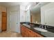 Spacious bathroom with dual sinks, granite countertops, and ample cabinet space at 2828 Peachtree Nw Rd # 1501, Atlanta, GA 30305