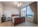 Cozy bedroom features a large window with stunning city views and comfortable furnishings at 2828 Peachtree Nw Rd # 1501, Atlanta, GA 30305