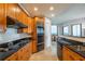 Charming kitchen with granite counters, stainless appliances, and views of the dining area at 2828 Peachtree Nw Rd # 1501, Atlanta, GA 30305