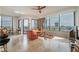 Bright living room featuring floor-to-ceiling windows and city views, leather seating, and neutral decor at 2828 Peachtree Nw Rd # 1501, Atlanta, GA 30305