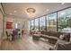 Bright living room featuring a dining area, comfortable seating, and a large window showcasing beautiful views at 2828 Peachtree Nw Rd # 1501, Atlanta, GA 30305