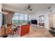 Bright living room featuring floor-to-ceiling windows with city views, comfortable seating, and neutral decor at 2828 Peachtree Nw Rd # 1501, Atlanta, GA 30305