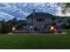 Spacious backyard features a pool, patio, fire bowls, grill, and well-maintained lawn at 440 Scott Farm Dr, Powder Springs, GA 30127