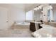Elegant bathroom featuring a soaking tub, marble countertops, and a large vanity area at 440 Scott Farm Dr, Powder Springs, GA 30127