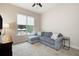 Bedroom featuring a sitting area, neutral decor, and ample natural light at 440 Scott Farm Dr, Powder Springs, GA 30127
