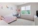 Bedroom featuring a desk area, a colorful decor, and natural light at 440 Scott Farm Dr, Powder Springs, GA 30127