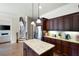 Bright, open kitchen showcasing granite countertops, stainless steel appliances, and a center island with bar seating at 440 Scott Farm Dr, Powder Springs, GA 30127