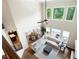 Two-story living room boasts large windows and abundant natural light, perfect for entertaining and relaxation at 440 Scott Farm Dr, Powder Springs, GA 30127