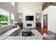 Bright living room featuring a fireplace, hardwood floors, and plenty of natural light at 440 Scott Farm Dr, Powder Springs, GA 30127