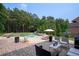 Backyard oasis with a swimming pool, lounge chairs, and lush landscaping at 440 Scott Farm Dr, Powder Springs, GA 30127