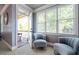 Comfortable sitting room features plush chairs, natural light, and an open doorway to an outdoor deck at 440 Scott Farm Dr, Powder Springs, GA 30127