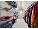 Spacious walk-in closet with built-in shelving for ample storage at 440 Scott Farm Dr, Powder Springs, GA 30127
