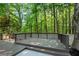 Spacious backyard deck surrounded by lush greenery, perfect for outdoor relaxation and entertaining at 562 Poplar Bnd, Canton, GA 30114