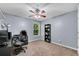 Comfortable bedroom with a ceiling fan, carpet and a window with view at 562 Poplar Bnd, Canton, GA 30114