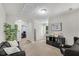 Versatile bonus room features a cozy seating area and ample natural light at 562 Poplar Bnd, Canton, GA 30114