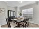 Elegant dining room featuring a table set for six beneath a window at 562 Poplar Bnd, Canton, GA 30114