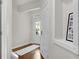 Bright foyer with wood flooring, white trim, and a view of the front door at 562 Poplar Bnd, Canton, GA 30114