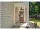 Charming front door entrance with covered porch and detailed trim work at 562 Poplar Bnd, Canton, GA 30114