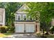 Charming two-story home with a well-manicured lawn and a two-car garage at 562 Poplar Bnd, Canton, GA 30114