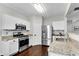 Contemporary kitchen featuring stainless steel appliances and granite countertops at 562 Poplar Bnd, Canton, GA 30114