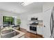 Well-equipped kitchen features stainless steel appliances and granite countertops at 562 Poplar Bnd, Canton, GA 30114