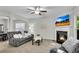 Bright living room boasts a fireplace and a comfortable seating area for entertaining at 562 Poplar Bnd, Canton, GA 30114